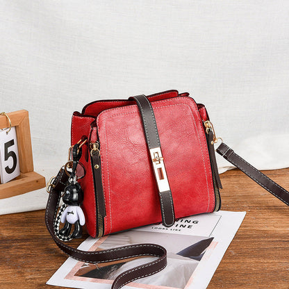 High-Quality PU Crossbody Bag with Doll Decor