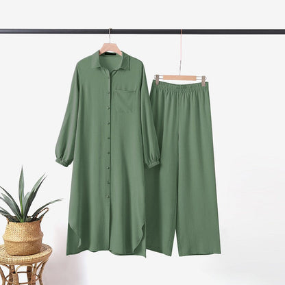 Two -part women's suit made of long shirt and pants with long sleeves and lapels