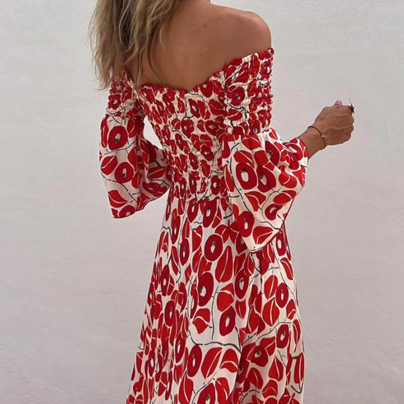 Robe longue avec motif floral, épaules ouvertes et manches exposées
