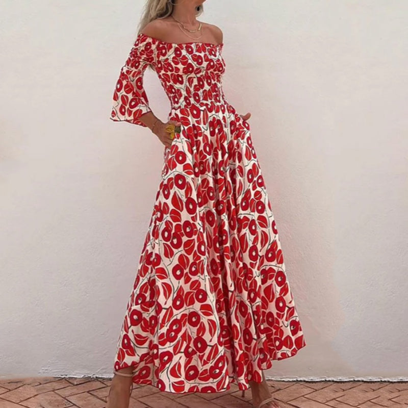 Robe longue avec motif floral, épaules ouvertes et manches exposées