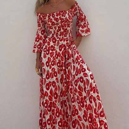 Robe longue avec motif floral, épaules ouvertes et manches exposées
