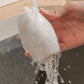 Rollador de pelusa lavable en forma de un pequeño pingüino