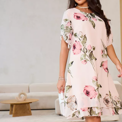 Flowing chiffon dress with blush-colored petals
