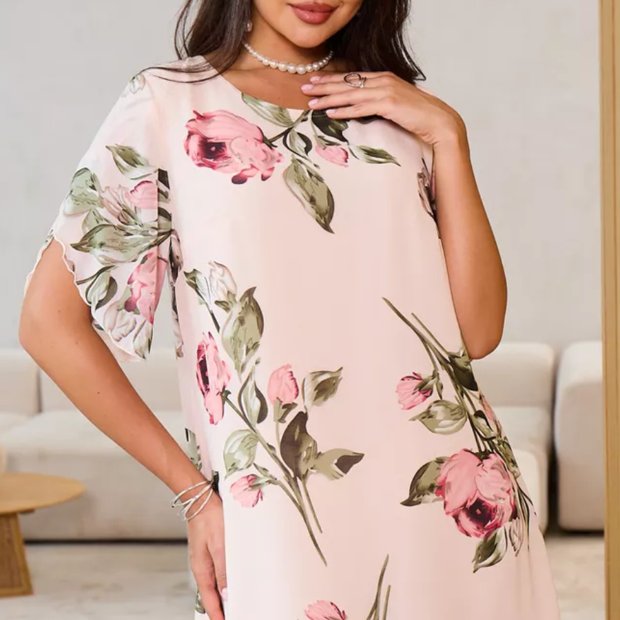 Flowing chiffon dress with blush-colored petals