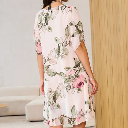 Flowing chiffon dress with blush-colored petals