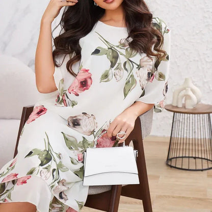 Flowing chiffon dress with blush-colored petals