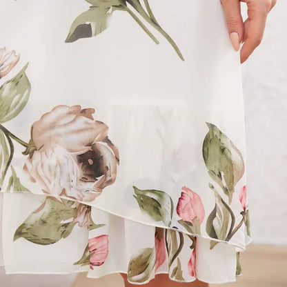 Flowing chiffon dress with blush-colored petals