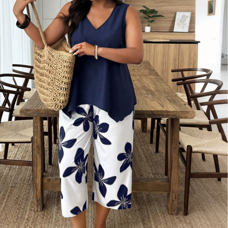🌸 NUR FÜR KURZE ZEIT: 55 % RABATT! ✨ Set aus asymmetrischem Damenoberteil und Caprihose mit Blumenmuster – vielseitig, farbenfroh, bequem 🌺
